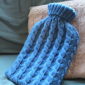 Knitted hot water bottle cover